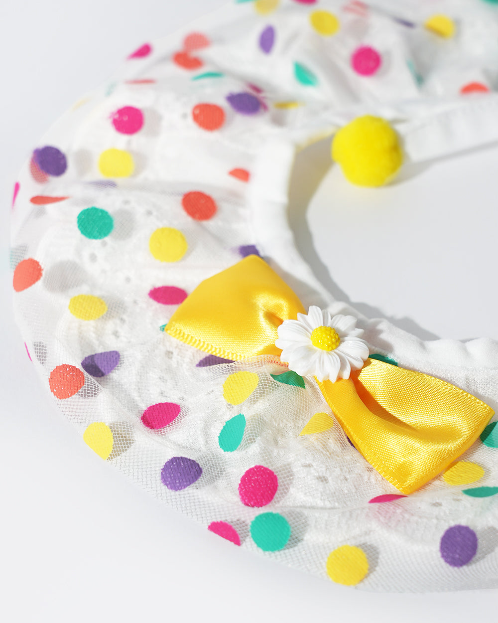 A dog bandana made from breathable and lightweight mesh lace and cotton fabric, designed with a yellow bow and daisy flower ornament, available size in XS, S, M,L,XL,XXL